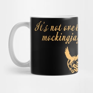 it's not over until the mockingjay sings. Mug